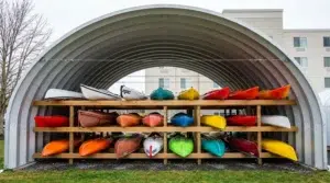 Quonset hut in Alberta storing colourful kayaks
