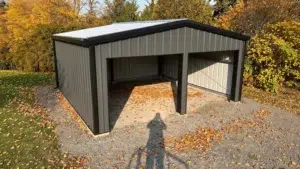 Grey charcoal steel garage with open bays surrounded by autumn leaves.