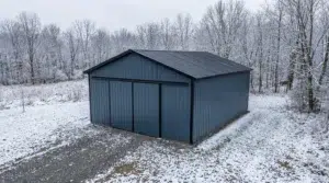 Slate blue steel garage in snowy winter landscape.