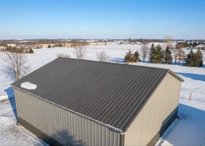 Aerial side view of a 30x40 steel building in snowy Ottawa landscape
