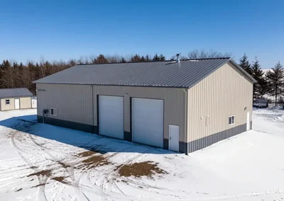 Aerial view of 30x58 steel commercial storage unit in snowy Markham setting.