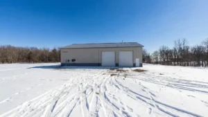 Steel construction commercial storage unit in snowy landscape