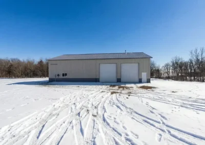 Steel construction commercial storage unit in snowy landscape