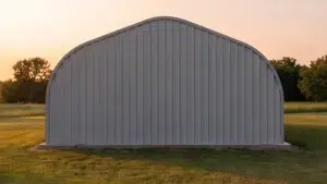 40 x 50 peaked straight Quonset steel building in a grassy field.