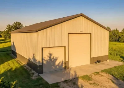 Modern steel hay storage barn at sunset in Orangeville.