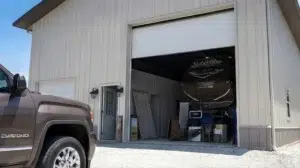 Prefabricated steel garage with open door in Kamloops, showcasing durability.