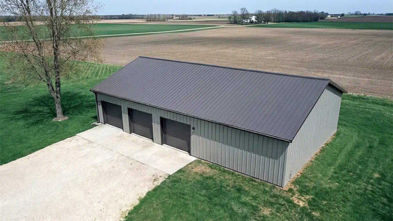 60x42 steel residential garage in Sudbury Ontario with three doors.